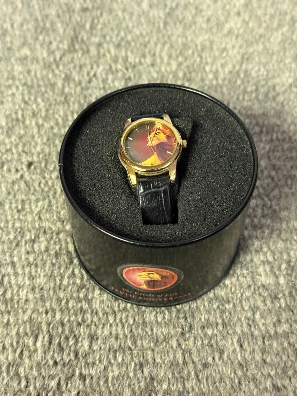 Gold-Tone Lion Kind Wristwatch with Black Leather Strap